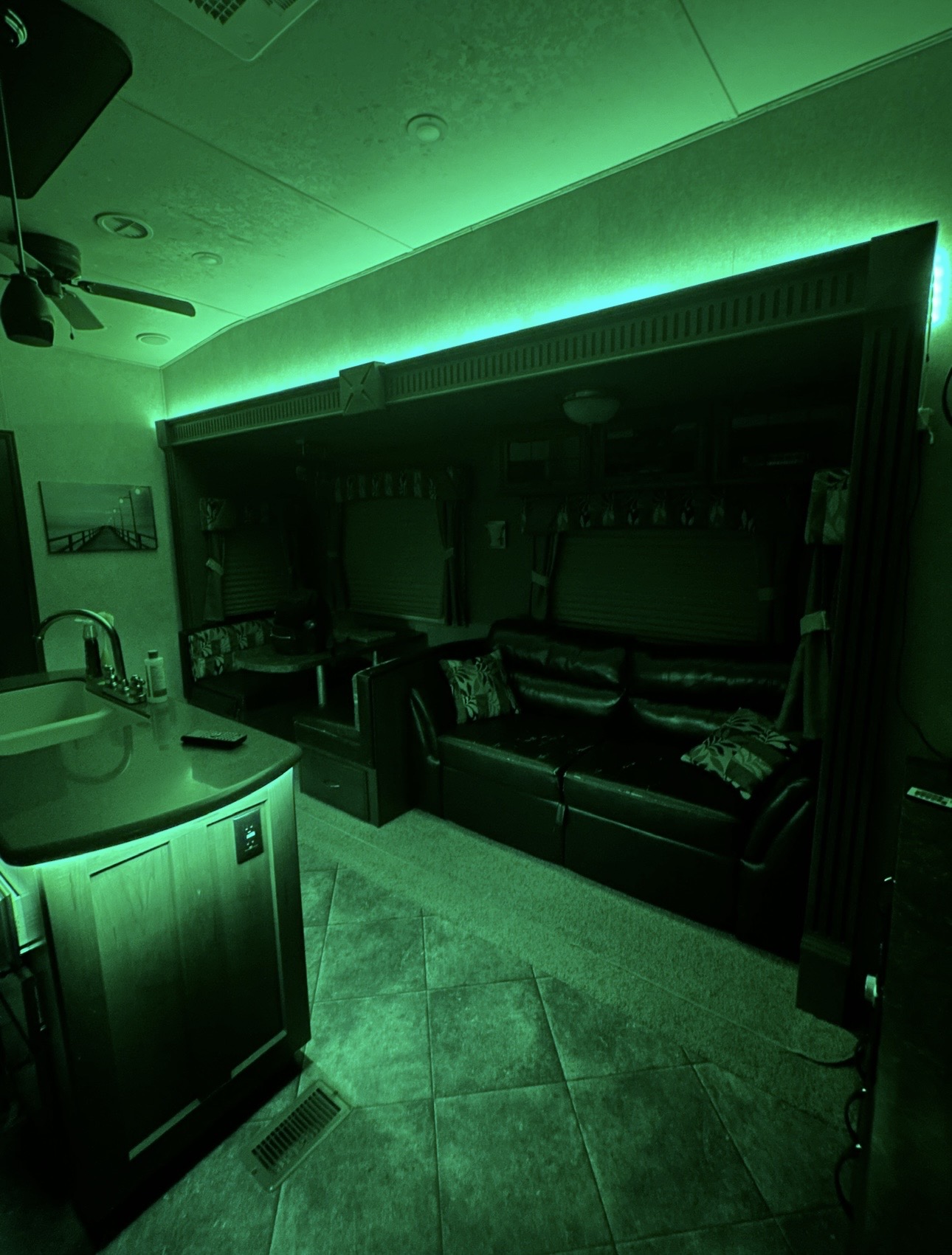 Green custom accent lighting installed inside an RV