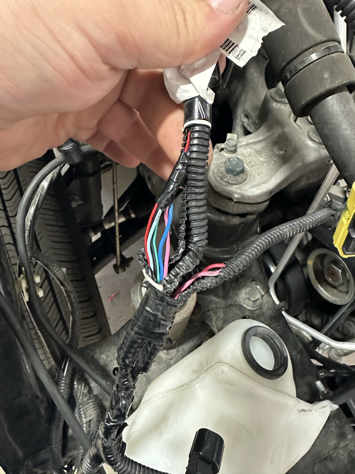 Damaged vehicle wiring harness opened for circuit repair